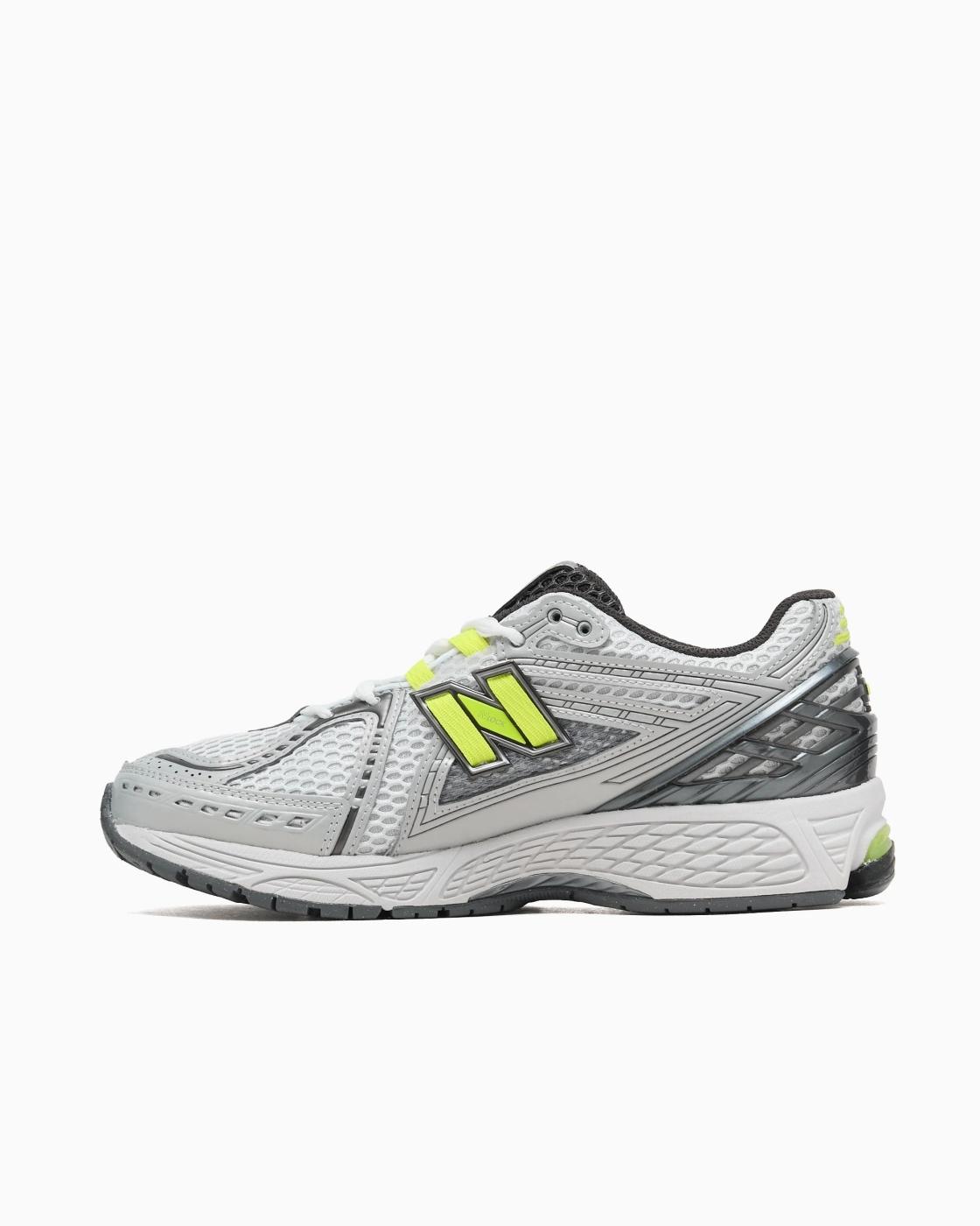 New Balance 1906 en Gris con Fluor